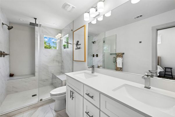 Bathroom, Dual Sink Vanities, Glass Shower, Interior, Marble, Marble Walls, Recessed Lighting
