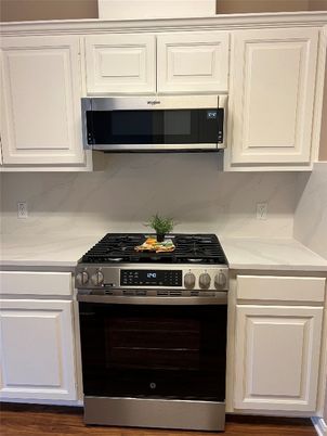 Interior, Kitchen, Marble Walls, Stainless Steel Appliances, Wood Texture Flooring