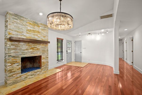 Chandelier, Empty room, Fireplace, Interior, Recessed Lighting, Wood Texture Flooring