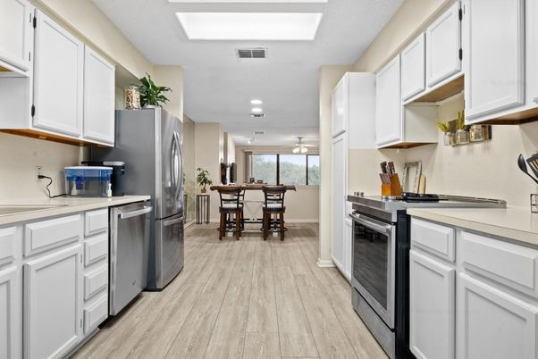 Dining room, Interior, Kitchen, Recessed Lighting, Stainless Steel Appliances, Wood Texture Flooring