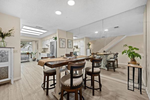 Dining room, Interior, Kitchen, Pendant Lights, Recessed Lighting, Stainless Steel Appliances, Wood Texture Flooring