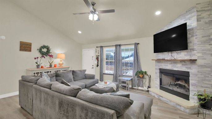 Fireplace, Interior, Living room, Recessed Lighting, Stone Walls, Wood Texture Flooring