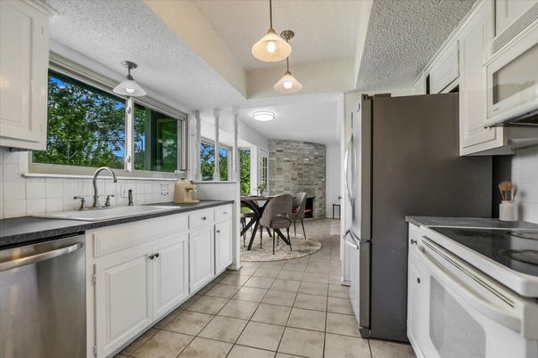 Dining room, Interior, Kitchen, Pendant Lights, Stainless Steel Appliances, Stone Walls