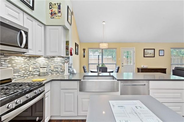 Dining room, Interior, Kitchen, Pendant Lights, Stainless Steel Appliances, Wood Texture Flooring
