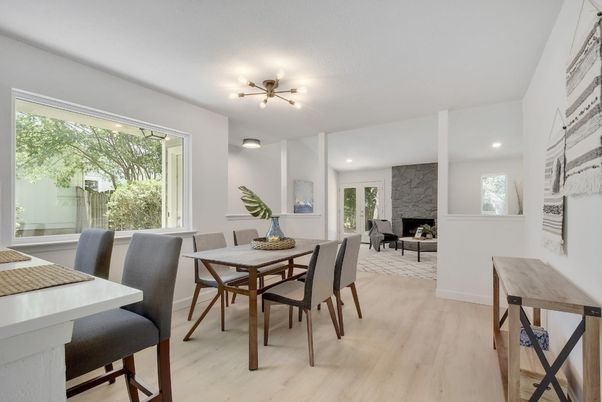 Dining room, Fireplace, Interior, Living room, Recessed Lighting, Wood Texture Flooring