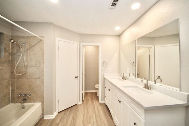 Bathroom, Dual Sink Vanities, Interior, Recessed Lighting, Wood Texture Flooring