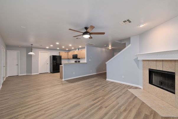 Empty room, Fireplace, Interior, Kitchen, Pendant Lights, Recessed Lighting, Wood Texture Flooring