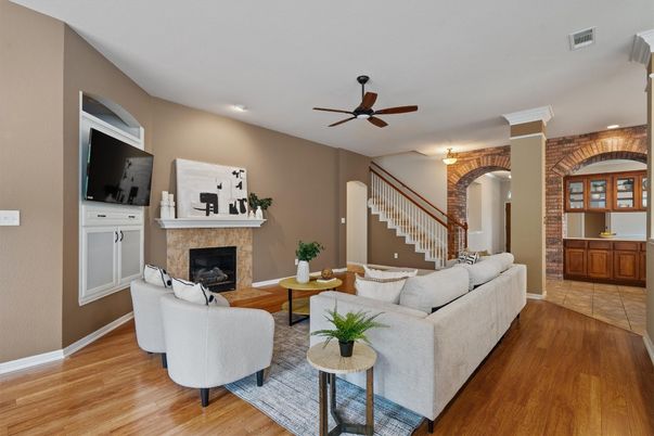 Fireplace, Interior, Living room, Recessed Lighting, Stone Walls, Wood Texture Flooring