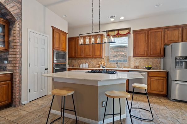 Interior, Kitchen, Pendant Lights, Recessed Lighting, Stainless Steel Appliances, Stone Walls