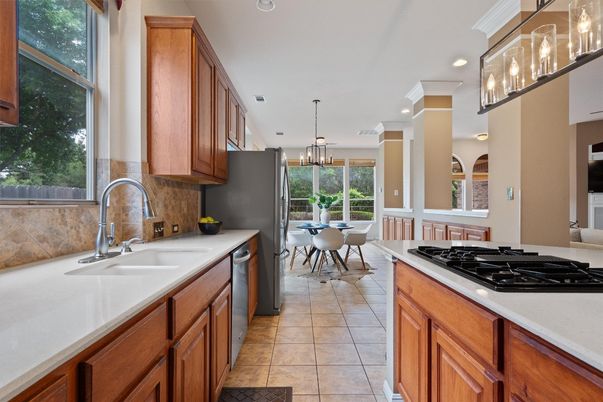Chandelier, Dining room, Interior, Kitchen, Pendant Lights, Recessed Lighting, Stainless Steel Appliances