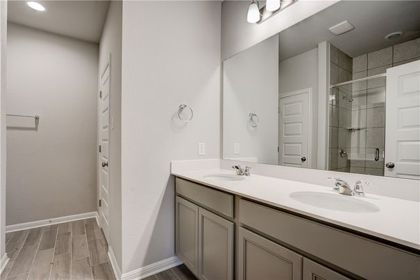 Bathroom, Dual Sink Vanities, Glass Shower, Interior, Recessed Lighting, Wood Texture Flooring