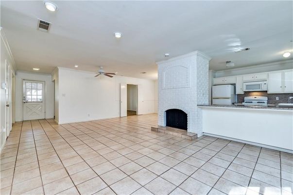 Empty room, Fireplace, Interior, Kitchen, Recessed Lighting, Stainless Steel Appliances