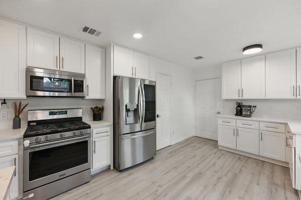 Interior, Kitchen, Recessed Lighting, Stainless Steel Appliances, Wood Texture Flooring