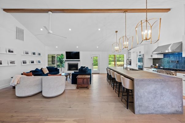Fireplace, Interior, Kitchen, Living room, Pendant Lights, Recessed Lighting, Stainless Steel Appliances, Wood Texture Flooring