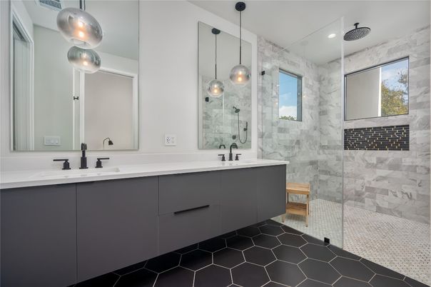 Bathroom, Dual Sink Vanities, Glass Shower, Interior, Marble Walls, Pendant Lights, Recessed Lighting