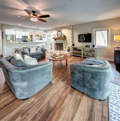 Fireplace, Interior, Kitchen, Living room, Recessed Lighting, Stainless Steel Appliances, Stone Walls, Wood Texture Flooring