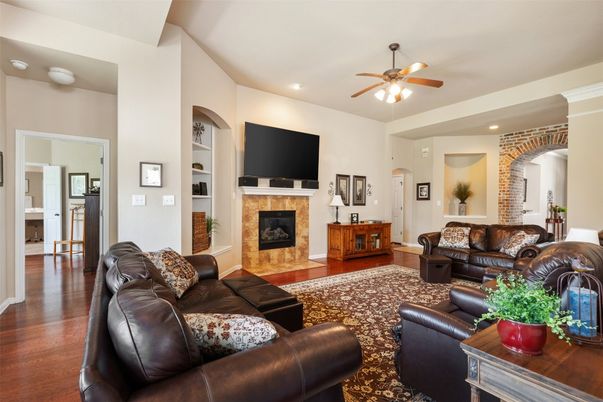 Fireplace, Interior, Living room, Recessed Lighting, Stone Walls, Wood Texture Flooring