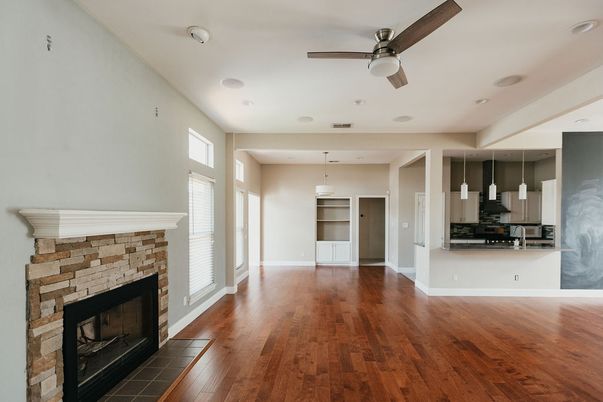 Empty room, Fireplace, Interior, Kitchen, Pendant Lights, Recessed Lighting, Wood Texture Flooring