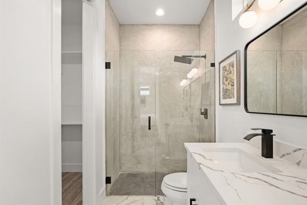 Bathroom, Glass Shower, Interior, Marble Walls, Recessed Lighting, Wood Texture Flooring