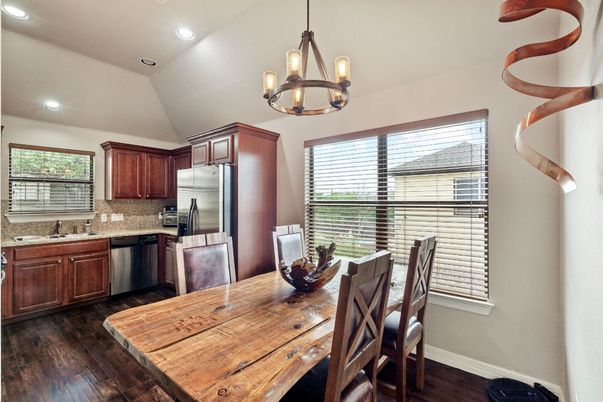 Dining room, Interior, Kitchen, Pendant Lights, Recessed Lighting, Stainless Steel Appliances, Wood Texture Flooring