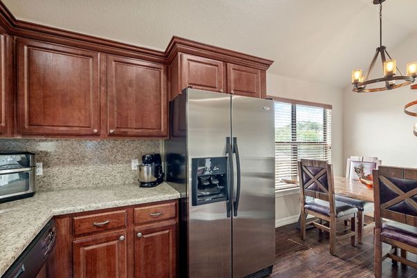 Chandelier, Dining room, Interior, Kitchen, Pendant Lights, Stainless Steel Appliances, Wood Texture Flooring