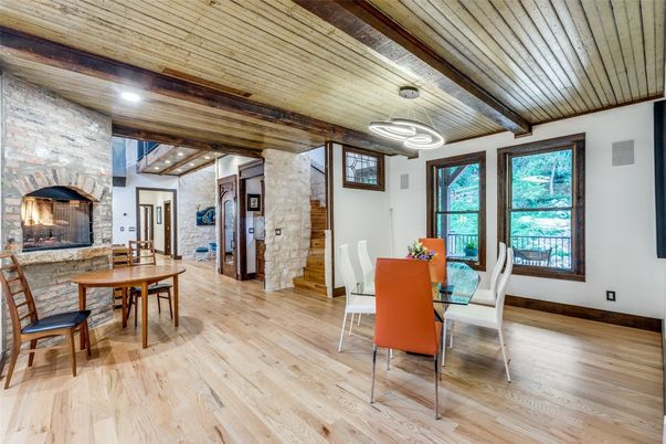 Dining room, Fireplace, Interior, Recessed Lighting, Stone Walls, Wooden Beams, Wooden Ceilings, Wood Texture Flooring