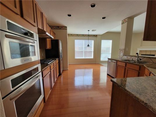 Interior, Kitchen, Pendant Lights, Recessed Lighting, Stainless Steel Appliances, Wood Texture Flooring