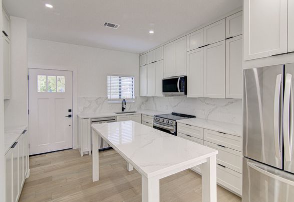 Interior, Kitchen, Marble Walls, Recessed Lighting, Stainless Steel Appliances, Wood Texture Flooring