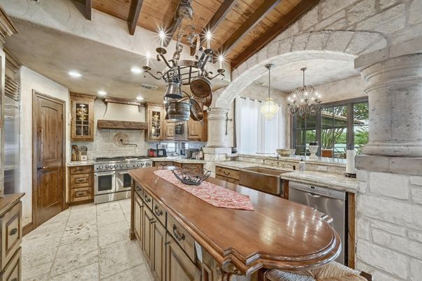 Chandelier, Interior, Kitchen, Pendant Lights, Recessed Lighting, Stainless Steel Appliances, Stone Walls, Wooden Beams, Wooden Ceilings