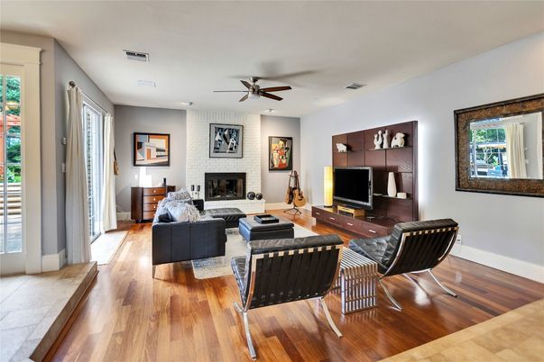 Fireplace, Interior, Living room, Recessed Lighting, Stone Walls, Wood Texture Flooring