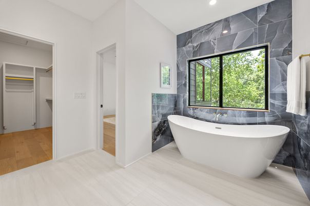 Bathroom, Free Standing Baths, Interior, Marble Walls, Recessed Lighting, Wood Texture Flooring