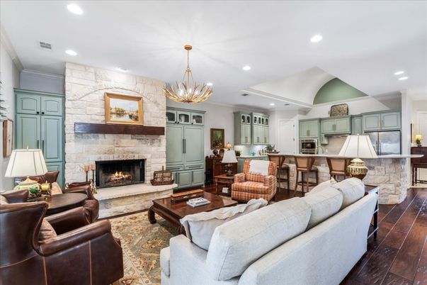 Chandelier, Fireplace, Interior, Kitchen, Living room, Pendant Lights, Recessed Lighting, Stone Walls, Wood Texture Flooring