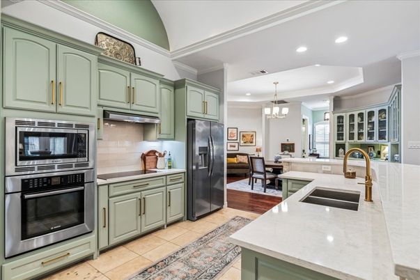 Chandelier, Dining room, Interior, Kitchen, Pendant Lights, Recessed Lighting, Stainless Steel Appliances, Wood Texture Flooring