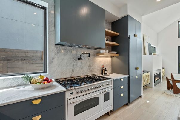 Fireplace, Interior, Kitchen, Marble Walls, Recessed Lighting, Stainless Steel Appliances, Wood Texture Flooring
