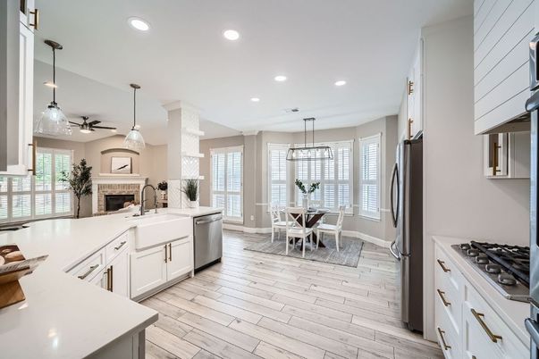 Dining room, Fireplace, Interior, Kitchen, Pendant Lights, Recessed Lighting, Stainless Steel Appliances, Wood Texture Flooring