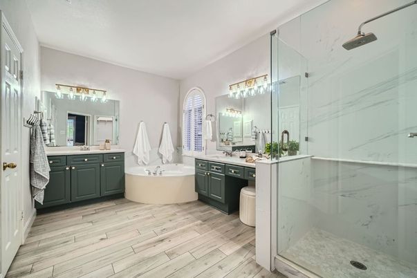 Bathroom, Dual Sink Vanities, Free Standing Baths, Glass Shower, Interior, Marble Walls, Wood Texture Flooring