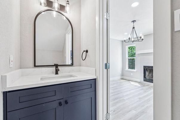 Bathroom, Chandelier, Fireplace, Interior, Recessed Lighting, Wood Texture Flooring