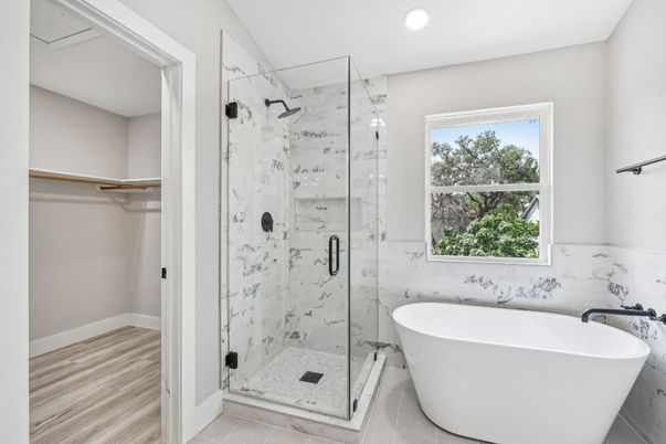 Bathroom, Free Standing Baths, Glass Shower, Interior, Marble Walls, Recessed Lighting, Wood Texture Flooring