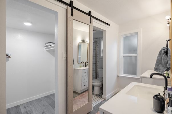 Bathroom, Dual Sink Vanities, Interior, Recessed Lighting, Wood Texture Flooring