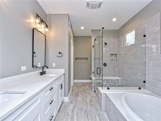 Bathroom, Dual Sink Vanities, Glass Shower, Interior, Recessed Lighting, Wood Texture Flooring