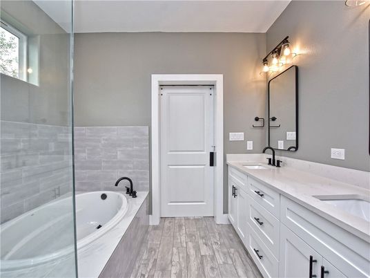 Bathroom, Dual Sink Vanities, Glass Shower, Interior, Wood Texture Flooring