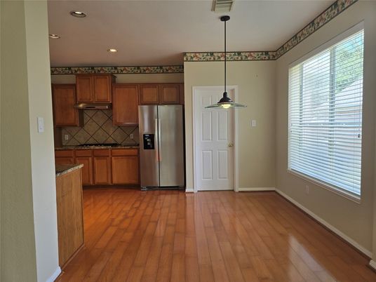 Empty room, Fireplace, Interior, Kitchen, Pendant Lights, Wood Texture Flooring