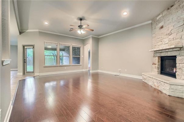 Empty room, Fireplace, Interior, Recessed Lighting, Stone Walls, Wood Texture Flooring