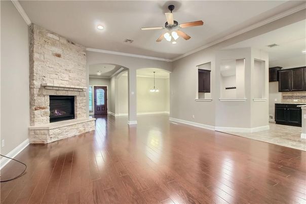 Empty room, Fireplace, Interior, Pendant Lights, Recessed Lighting, Stone Walls, Wood Texture Flooring