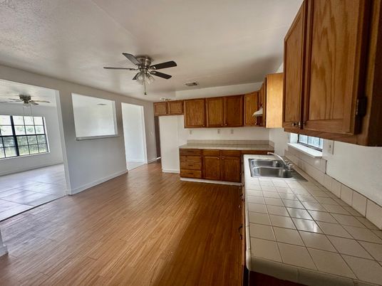 Interior, Kitchen, Tile Countertops, Wood Texture Flooring