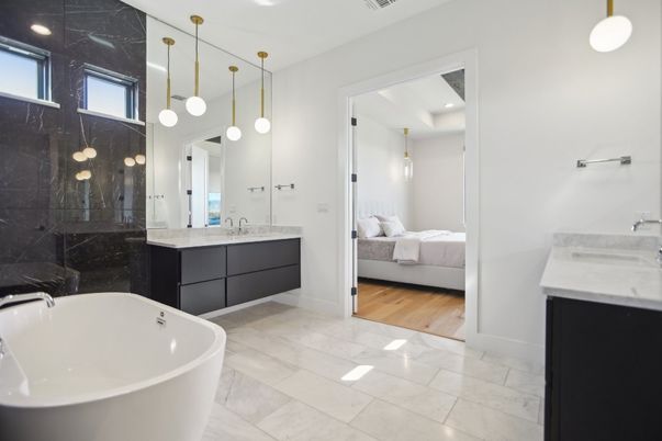 Bathroom, Bedroom, Dual Sink Vanities, Free Standing Baths, Glass Shower, Interior, Marble, Marble Walls, Pendant Lights, Recessed Lighting, Wood Texture Flooring