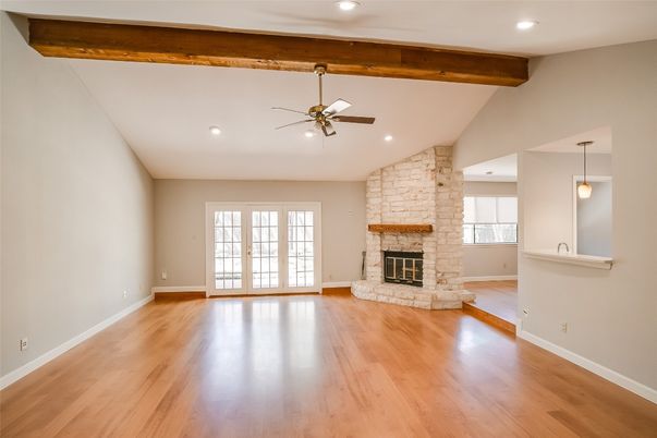 Empty room, Fireplace, Interior, Pendant Lights, Recessed Lighting, Stone Walls, Wooden Beams, Wood Texture Flooring