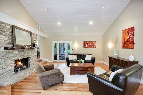 Fireplace, Interior, Living room, Recessed Lighting, Stone Walls, Wood Texture Flooring
