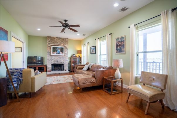 Fireplace, Interior, Living room, Recessed Lighting, Stone Walls, Wood Texture Flooring