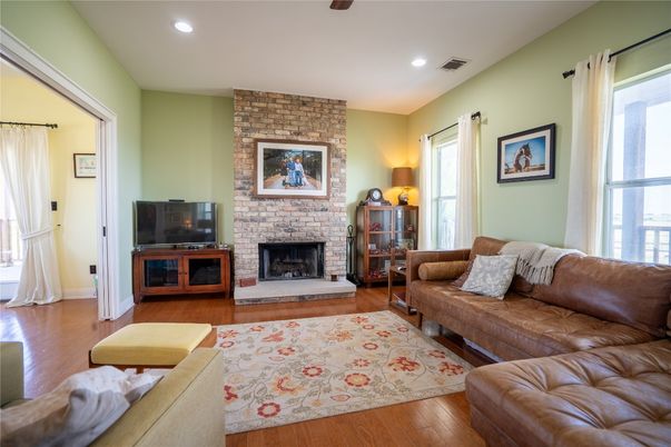 Fireplace, Interior, Living room, Recessed Lighting, Stone Walls, Wood Texture Flooring
